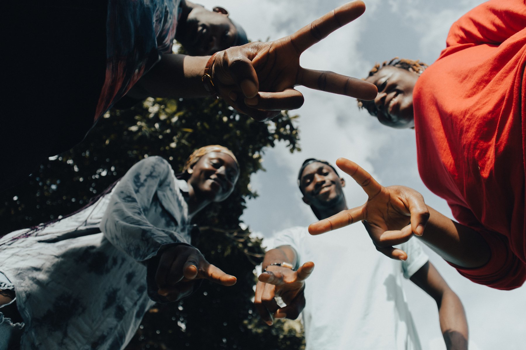 Group of Youth Doing Peace Sign Outdoors